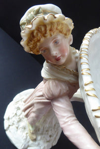 ROYAL WORCESTER James Hadley Figurine after Kate Greenaway. Lady Carrying a Large Wicket Basket