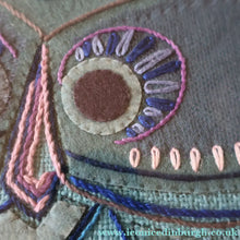Load image into Gallery viewer, LARGE Kitsch Embroidery Turquoise Tweed Collage Panel Showing a Large Stylized Owl. In original 60s frame
