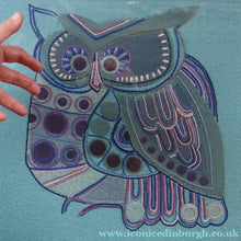 Load image into Gallery viewer, LARGE Kitsch Embroidery Turquoise Tweed Collage Panel Showing a Large Stylized Owl. In original 60s frame

