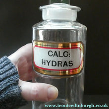Load image into Gallery viewer, Antique Clear Glass Chemist Bottle. CALC: HYDRAS with Original Foil Label and Lozenge Stopper
