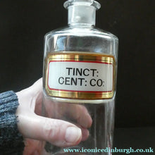 Load image into Gallery viewer, Larger Antique Clear Glass Chemist Bottle. TINCT: CENT: CO: with Original Foil Label and Lozenge Stopper
