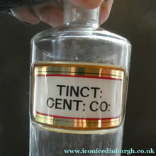 Load image into Gallery viewer, Larger Antique Clear Glass Chemist Bottle. TINCT: CENT: CO: with Original Foil Label and Lozenge Stopper
