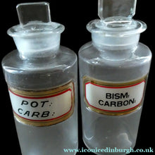 Load image into Gallery viewer, PAIR OF Larger Antique Clear Glass Chemist Bottles with Original Foil Labels and Lozenge Stoppers
