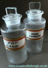 Load image into Gallery viewer, PAIR OF Larger Antique Clear Glass Chemist Bottles with Original Foil Labels and Lozenge Stoppers
