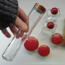 Load image into Gallery viewer, 1950s Red Enamel Topped and Glass Vanity Pots and Bottles. Vintage Glamour
