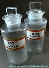 Load image into Gallery viewer, PAIR OF Larger Antique Clear Glass Chemist Bottles with Original Foil Labels and Lozenge Stoppers
