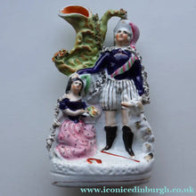 Load image into Gallery viewer, Rarer ANTIQUE Staffordshire Figurine / Spill Vase Featuring a Man and Woman with Dog Standing Beside a Tree
