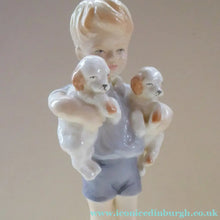 Load image into Gallery viewer, Royal Worcester Figurine. ALL MINE.  Modelled by Freda Doughty. No 3519. Boy Holding Puppies
