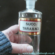 Load image into Gallery viewer, Small Antique Clear Glass Chemist Bottle. SUCC: TARAXACI with Original Foil Label and Lozenge Stopper
