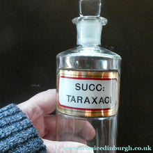 Load image into Gallery viewer, Small Antique Clear Glass Chemist Bottle. SUCC: TARAXACI with Original Foil Label and Lozenge Stopper
