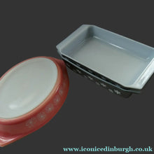 Load image into Gallery viewer, Two Pyrex Dishes. No Lids. Black Oblong. Pink Oval. Snowflake Pattern
