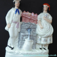 Load image into Gallery viewer, Antique STAFFORDSHIRE Flatback Figurine. Victorian Couple Standing Beside a Water Wall. Excellent Condition
