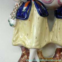Load image into Gallery viewer, Antique Staffordshire Figurine. Pair of Scottish Lasses Dancing. Antique Ceramic Pocket Watch Holder
