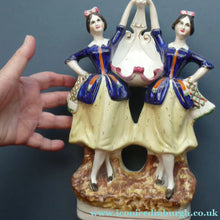 Load image into Gallery viewer, Antique Staffordshire Figurine. Pair of Scottish Lasses Dancing. Antique Ceramic Pocket Watch Holder
