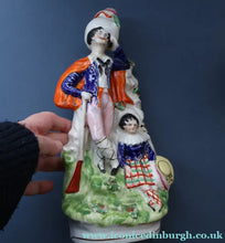Load image into Gallery viewer, Antique STAFFORDSHIRE Figurine. Rarer Modelled Group: A Huntsman and Little Seated Girl. Excellent Condition. 10 1/4 inches high
