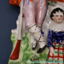 Load image into Gallery viewer, Antique STAFFORDSHIRE Figurine. Rarer Modelled Group: A Huntsman and Little Seated Girl. Excellent Condition. 10 1/4 inches high
