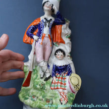 Load image into Gallery viewer, Antique STAFFORDSHIRE Figurine. Rarer Modelled Group: A Huntsman and Little Seated Girl. Excellent Condition. 10 1/4 inches high
