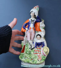 Load image into Gallery viewer, Antique STAFFORDSHIRE Figurine. Rarer Modelled Group: A Huntsman and Little Seated Girl. Excellent Condition. 10 1/4 inches high

