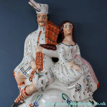 Load image into Gallery viewer, ANTIQUE Victorian Staffordshire Flatback Figurine. A Highlander and his Sweetheart Sitting on a Clock Face. Poor Man's Clock
