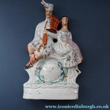 Load image into Gallery viewer, ANTIQUE Victorian Staffordshire Flatback Figurine. A Highlander and his Sweetheart Sitting on a Clock Face. Poor Man's Clock
