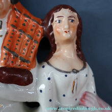 Load image into Gallery viewer, ANTIQUE Victorian Staffordshire Flatback Figurine. A Highlander and his Sweetheart Sitting on a Clock Face. Poor Man's Clock
