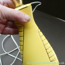 Load image into Gallery viewer, Vintage 1950s Pottery Table Lamp with White Drum Shade. Yellow Triangular Shape with Gold Decoration
