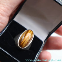 Load image into Gallery viewer, Vintage 1977 Hallmarked Space Age Silver Rings with Oval Tiger's Eye Inclusion. Size O

