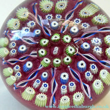 Load image into Gallery viewer, Vintage JOHN DEACONS Paperweight Cranberry Glass Ground, Millefiori Canes &amp; Nine Half Spokes. StK Cane
