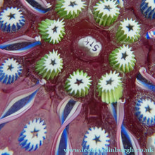 Load image into Gallery viewer, Vintage JOHN DEACONS Paperweight Cranberry Glass Ground, Millefiori Canes &amp; Nine Half Spokes. StK Cane
