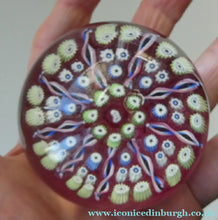 Load image into Gallery viewer, Vintage JOHN DEACONS Paperweight Cranberry Glass Ground, Millefiori Canes &amp; Nine Half Spokes. StK Cane

