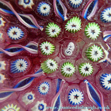 Load image into Gallery viewer, Vintage JOHN DEACONS Paperweight Cranberry Glass Ground, Millefiori Canes &amp; Nine Half Spokes. StK Cane
