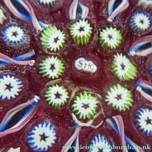 Load image into Gallery viewer, Vintage JOHN DEACONS Paperweight Cranberry Glass Ground, Millefiori Canes &amp; Nine Half Spokes. StK Cane
