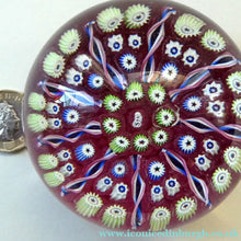Load image into Gallery viewer, Vintage JOHN DEACONS Paperweight Cranberry Glass Ground, Millefiori Canes &amp; Nine Half Spokes. StK Cane
