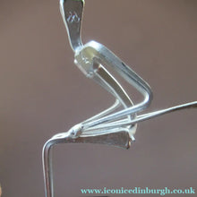 Load image into Gallery viewer, Scottish Horseshoe Nail Sculpture of a Skiing Man

