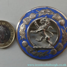 Load image into Gallery viewer, Vintage White Metal Celtic Style Brooch with Lion Rampant Motif, Thistle Motifs and Blue Enamel
