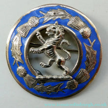 Load image into Gallery viewer, Vintage White Metal Celtic Style Brooch with Lion Rampant Motif, Thistle Motifs and Blue Enamel
