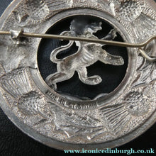 Load image into Gallery viewer, Vintage White Metal Celtic Style Brooch with Lion Rampant Motif, Thistle Motifs and Blue Enamel
