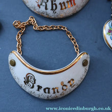 Load image into Gallery viewer, Wee Job Lot: Four Vintage Bottle Labels. The Port One is Coalport. Two Limoges &amp; One White Metal Whisky - Bottle Labels
