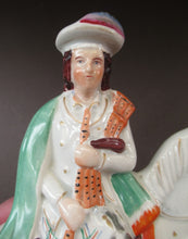 Load image into Gallery viewer, Antique Staffordshire on Scottish Horseman Playing the Bagpipes
