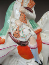 Load image into Gallery viewer, Antique Staffordshire on Scottish Horseman Playing the Bagpipes
