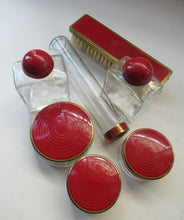 Load image into Gallery viewer, 1950s Red Enamel Topped and Glass Vanity Pots and Bottles. Vintage Glamour
