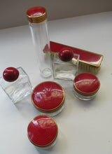 Load image into Gallery viewer, 1950s Red Enamel Topped and Glass Vanity Pots and Bottles. Vintage Glamour

