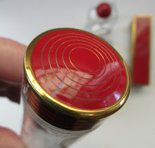 Load image into Gallery viewer, 1950s Red Enamel Topped and Glass Vanity Pots and Bottles. Vintage Glamour
