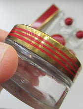 Load image into Gallery viewer, 1950s Red Enamel Topped and Glass Vanity Pots and Bottles. Vintage Glamour
