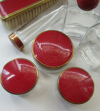 Load image into Gallery viewer, 1950s Red Enamel Topped and Glass Vanity Pots and Bottles. Vintage Glamour
