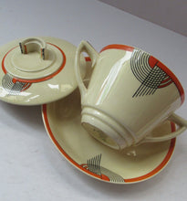 Load image into Gallery viewer, Royal Doulton 1930s Art Deco Royal Tango Lidded Cup and Saucer
