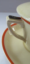 Load image into Gallery viewer, Royal Doulton 1930s Art Deco Royal Tango Lidded Cup and Saucer
