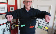 Load image into Gallery viewer, Vintage 1950s Wire Work Coat rack with Musical Notes in Coloured Plastic
