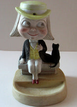 Load image into Gallery viewer, Antique Porcelain Nodder or Swinger Pin Tray by Schafer &amp; Vater. Boy Wearing Yellow Straw Hat with Black Cat
