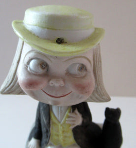Antique Porcelain Nodder or Swinger Pin Tray by Schafer & Vater. Boy Wearing Yellow Straw Hat with Black Cat